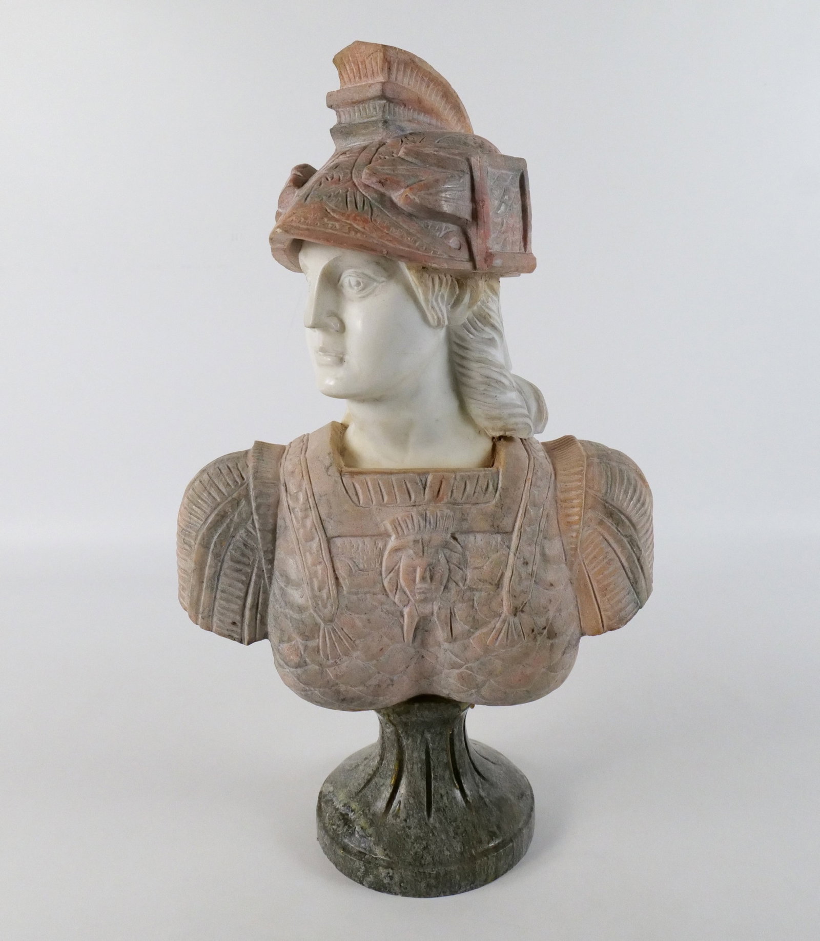 Carved Alabaster Bust of Roman Soldier: Carved Alabaster Bust of Roman Soldier. Comes on pedestal base. Circa late 20th century. Base may not be original to bust. Showing signs of glue coming down the base. Measures 20" tall x 12" wide. All