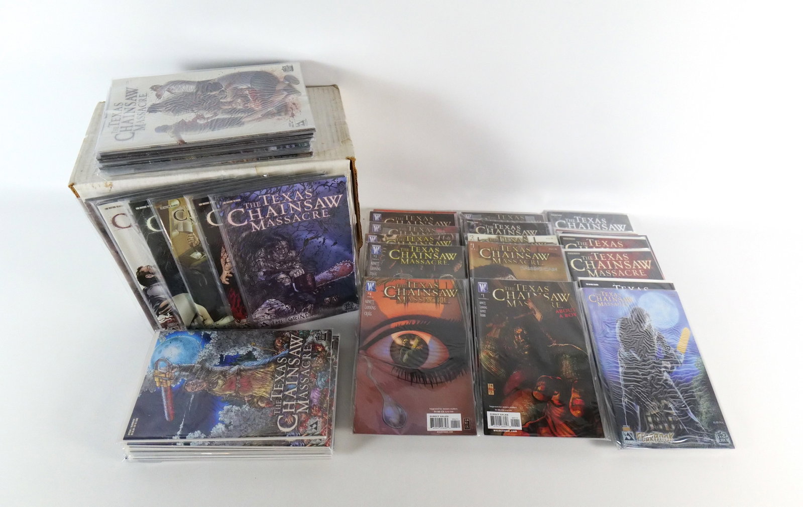 Short Box of Texas Chainsaw Massacre Comics: Short Box of Texas Chainsaw Massacre Comics. Including Avatar: One Shot by Brian Pulido with multiples and variants, The Grind with multiples and variants, Fearbook with multiples and variants, and Wi