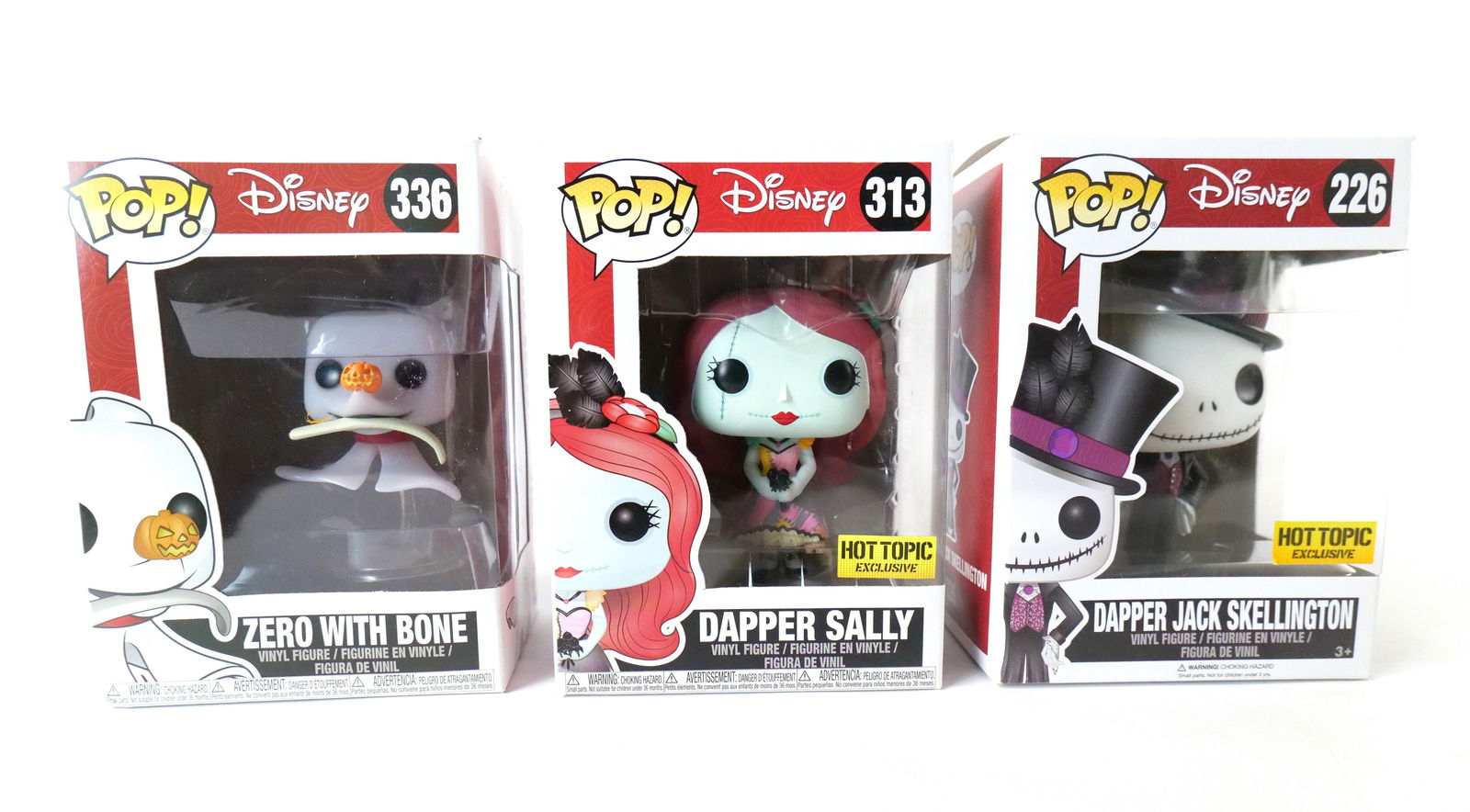 Lot of 3 Funko Nightmare Before Christmas Pops: Lot of 3 Funko Disney Nightmare Before Christmas Pops. Including Dapper Jack Skellington #226 - Hot Topic Exclusive, Dapper Sally #313 - Hot Topic Exclusive, and Zero with Bone #336. All new in boxes.