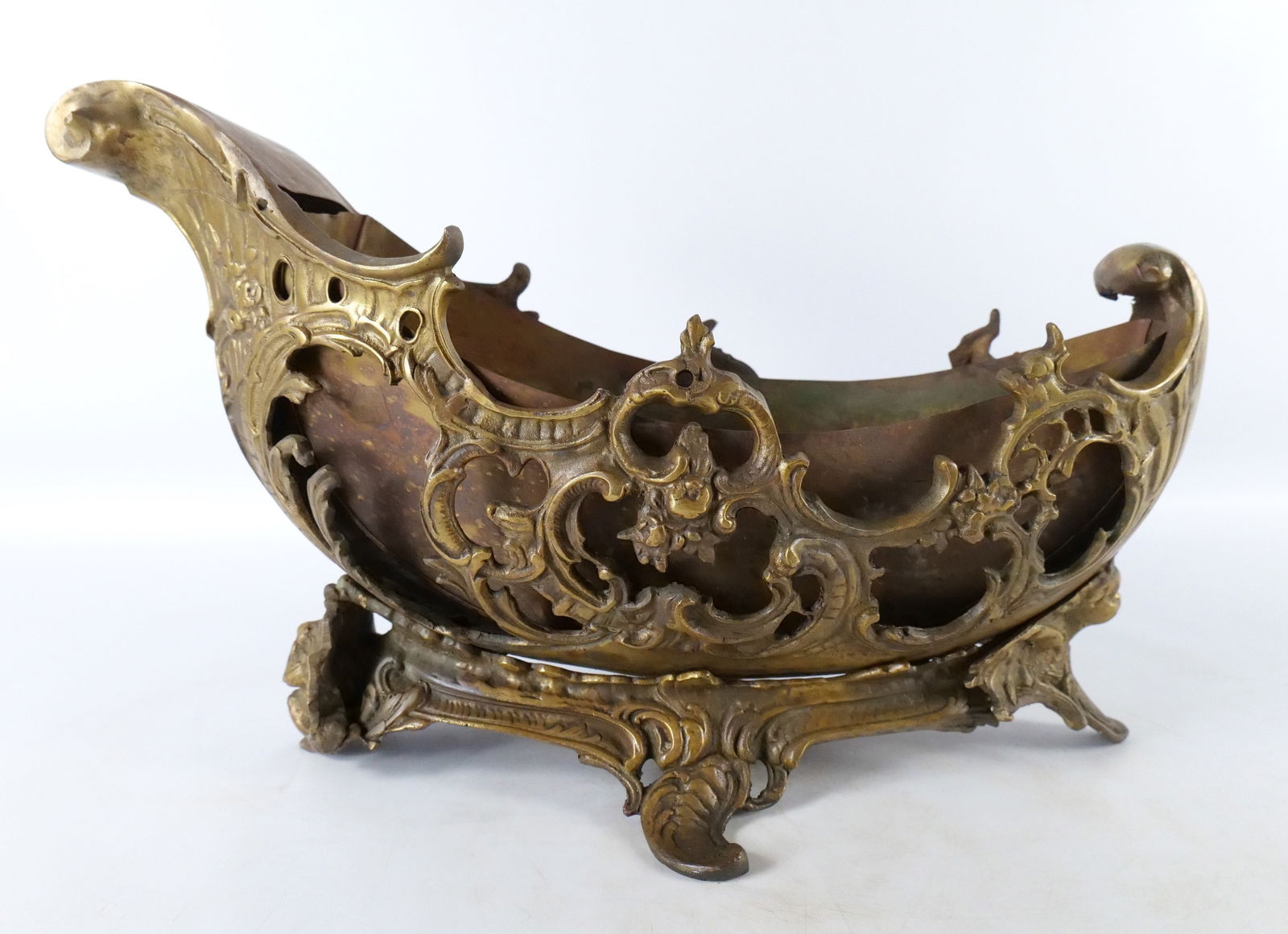 Antique Bronze Center Basket: Antique Bronze Center Basket. Baroque Design. Comes with insert. Can be used for flowers or fruit. Circa Turn of the Century. Measures 13" tall x 18.5" long. All invoices must be paid within 24 hours