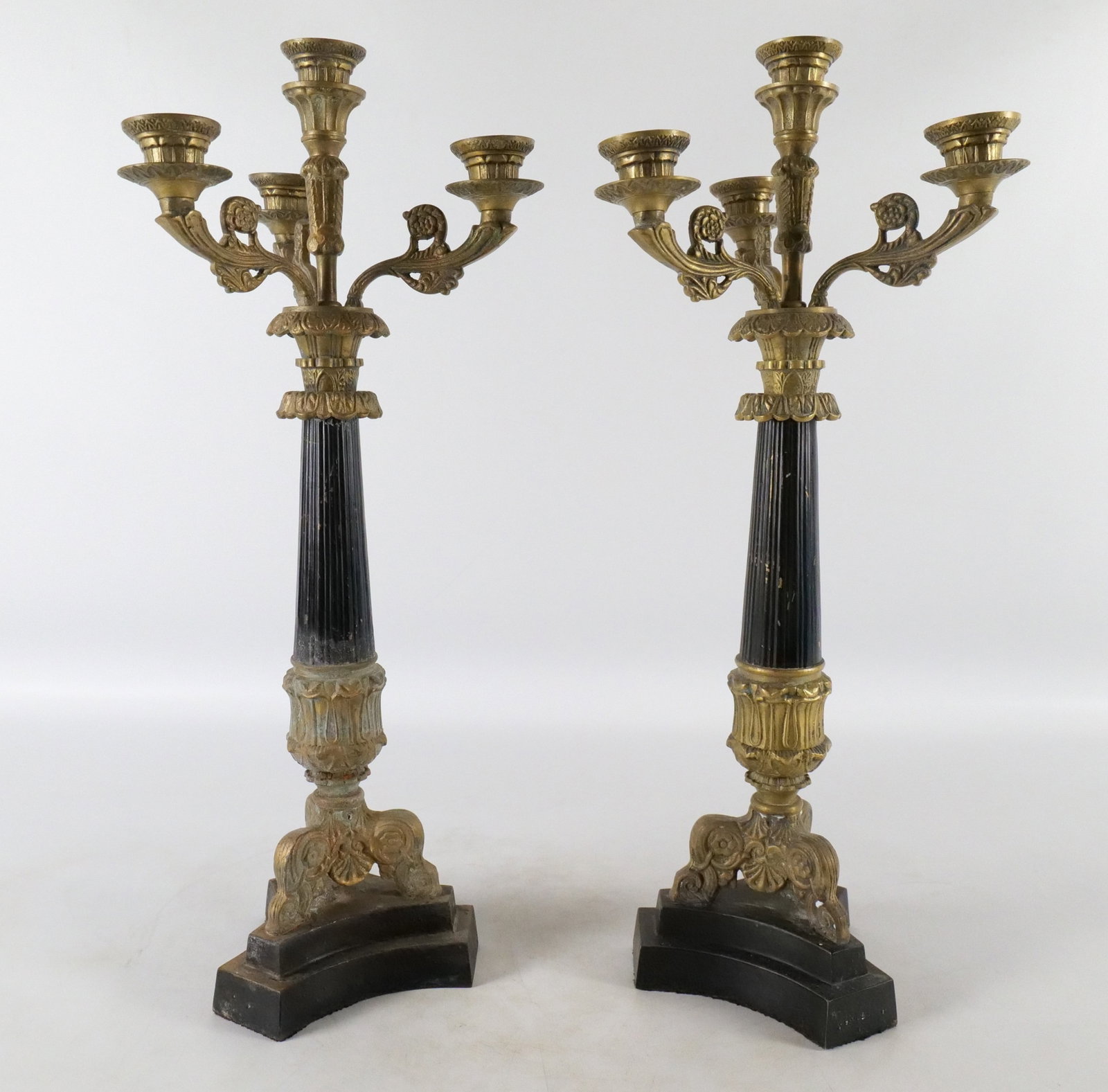 Pair of Mixed Metal Candelabras: Pair of Mixed Metal Candelabras. One showing water damage. Both have a black painted column support. Circa late 20th century. Measures 21" tall x 9" wide. All invoices must be paid within 24 hours of 