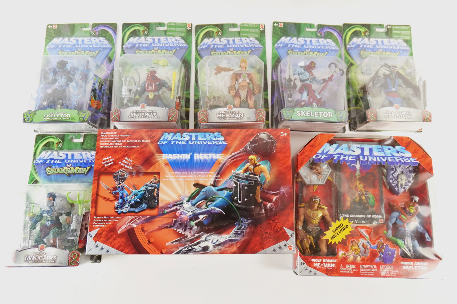 Group of Masters of the Universe Figures: Group of Masters of the Universe figures including MOTU vs SnakeMen - Man at Arms, Snake Hunter He-Man, Ice Armor Skeletor, Serpent Track Mekaneck, Sky Strike Stratos and Skeletor. Also included is MO