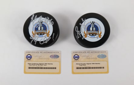 Lot of 2 New York Rangers Signed Stanley Cup Hockey Pucks