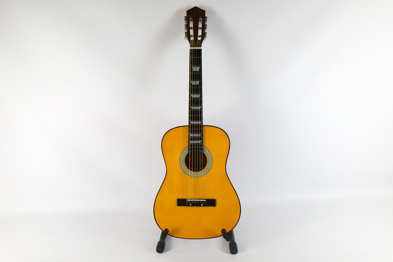 Strong Wind Acoustic Guitar: Strong Wind Six String Acoustic Guitar. Bridge has been reattached. Drill mark on the top edge of the headstock. Measures 36" long x 13.5" wide. All guitars came from a single owner collection and all