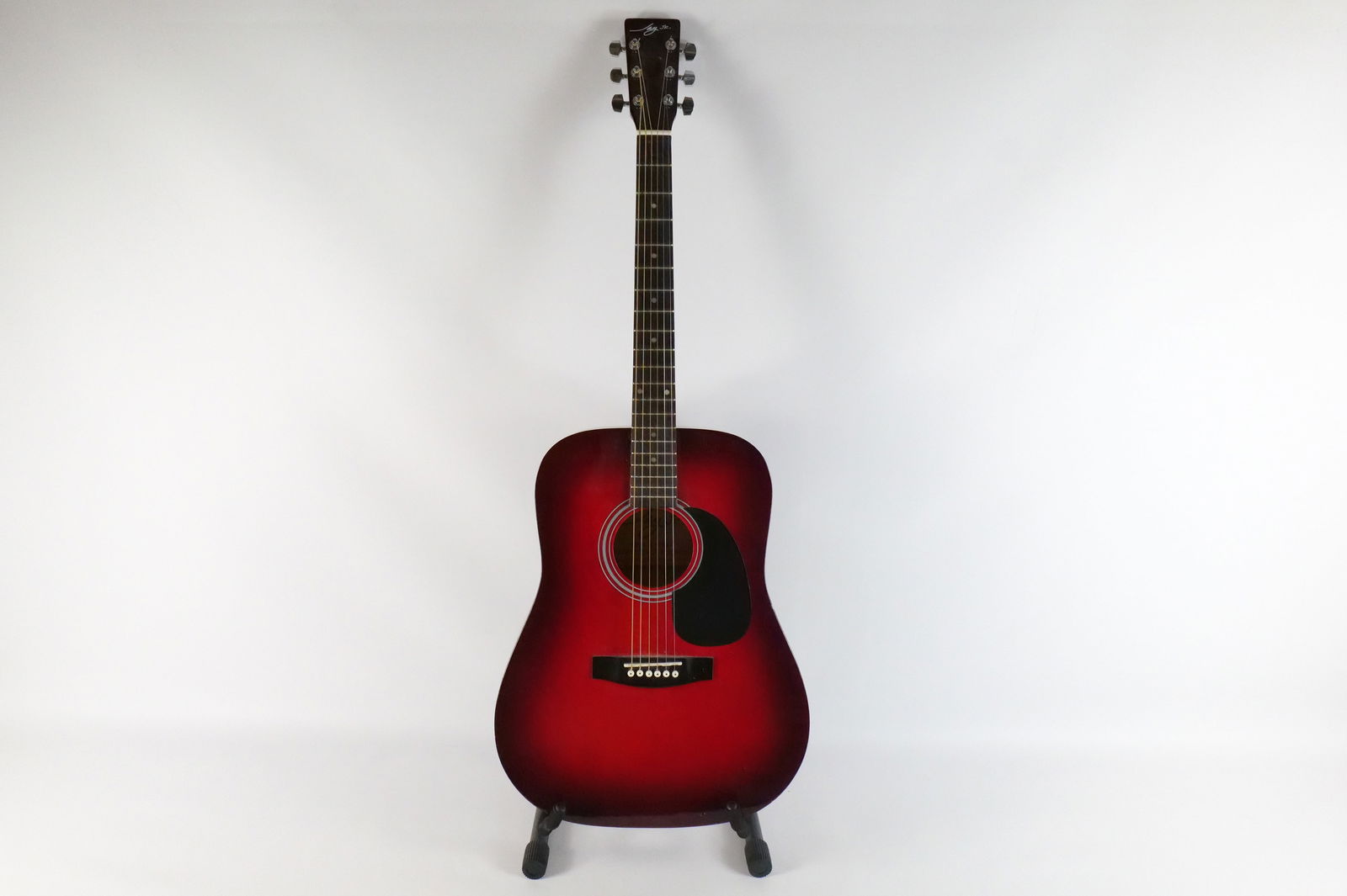Jay Jr. Acoustic Guitar: Jay Jr. Six String Acoustic Guitar. Model No. J-TRD\TR. Does have some scratching. Drill mark on the top edge of the headstock. Measures 41" long x 16" wide. All guitars came from a single owner colle