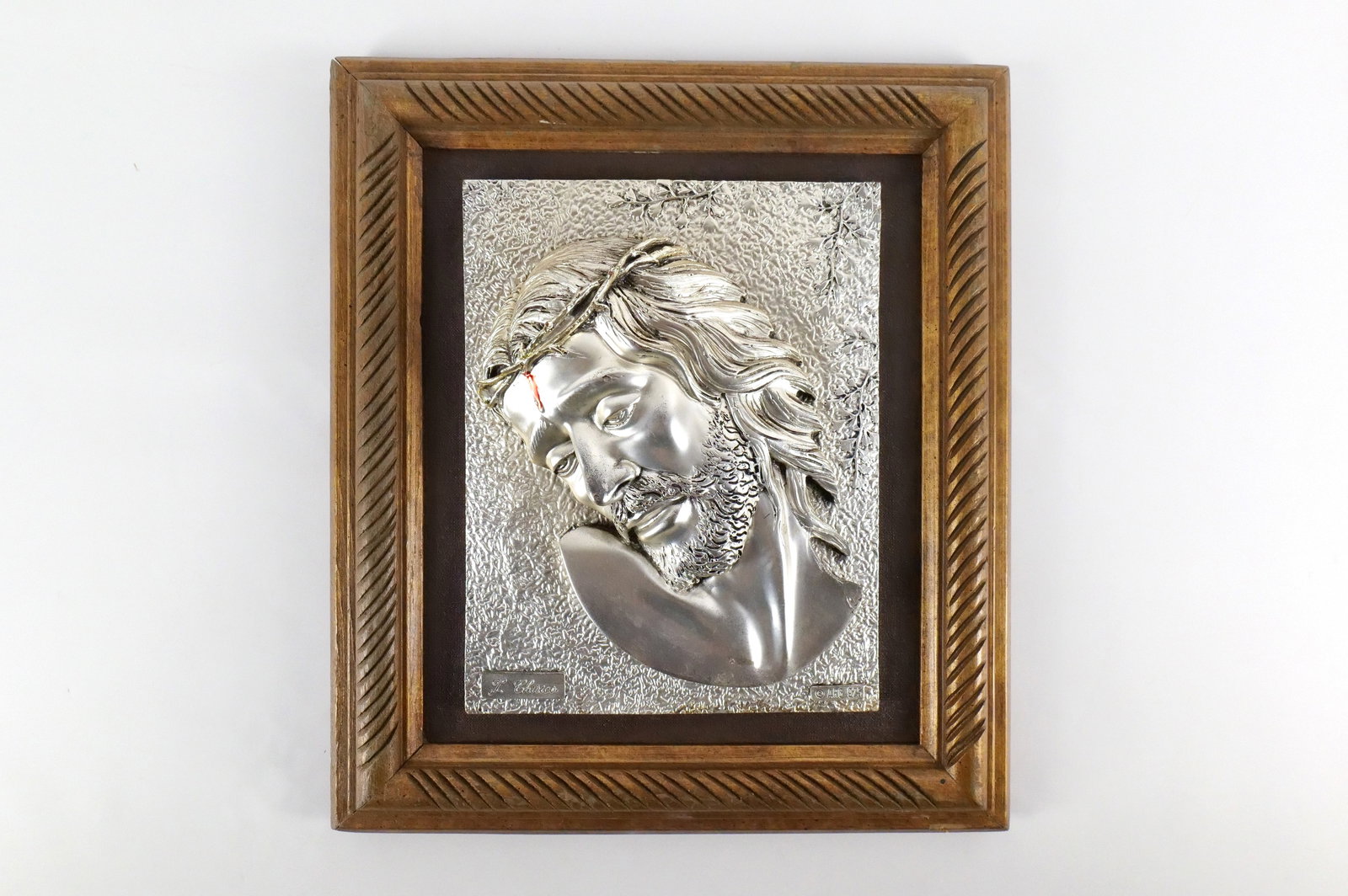 Framed Portrait of Jesus: Framed Portrait of Jesus by Chirico. Copyright ARG. Marked 925. Sterling Silver Overlay over Resin. Measures 17" long x 14.75" wide. All invoices must be paid within 24 hours of the sale. We offer mul
