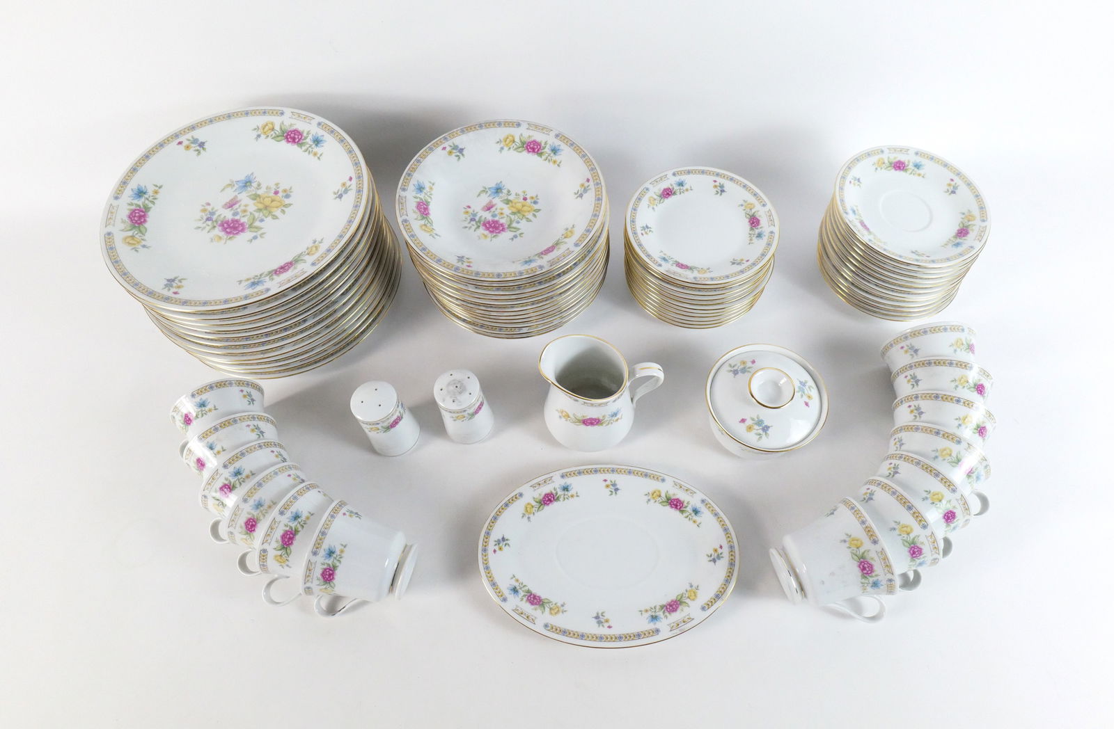 Partial Dinnerware Set: Partial Dinnerware Set. Liling Fine China. Young Shen. Includes (12) Dinner Plates, (13) Cups, (12) Saucers, (11) Dessert Plates, (12) Salad Bowls, Salt, Pepper, Creamer, Sugar and Underplate for grav