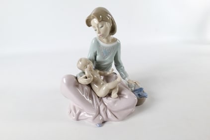 Lladro Dressing the Baby Figurine