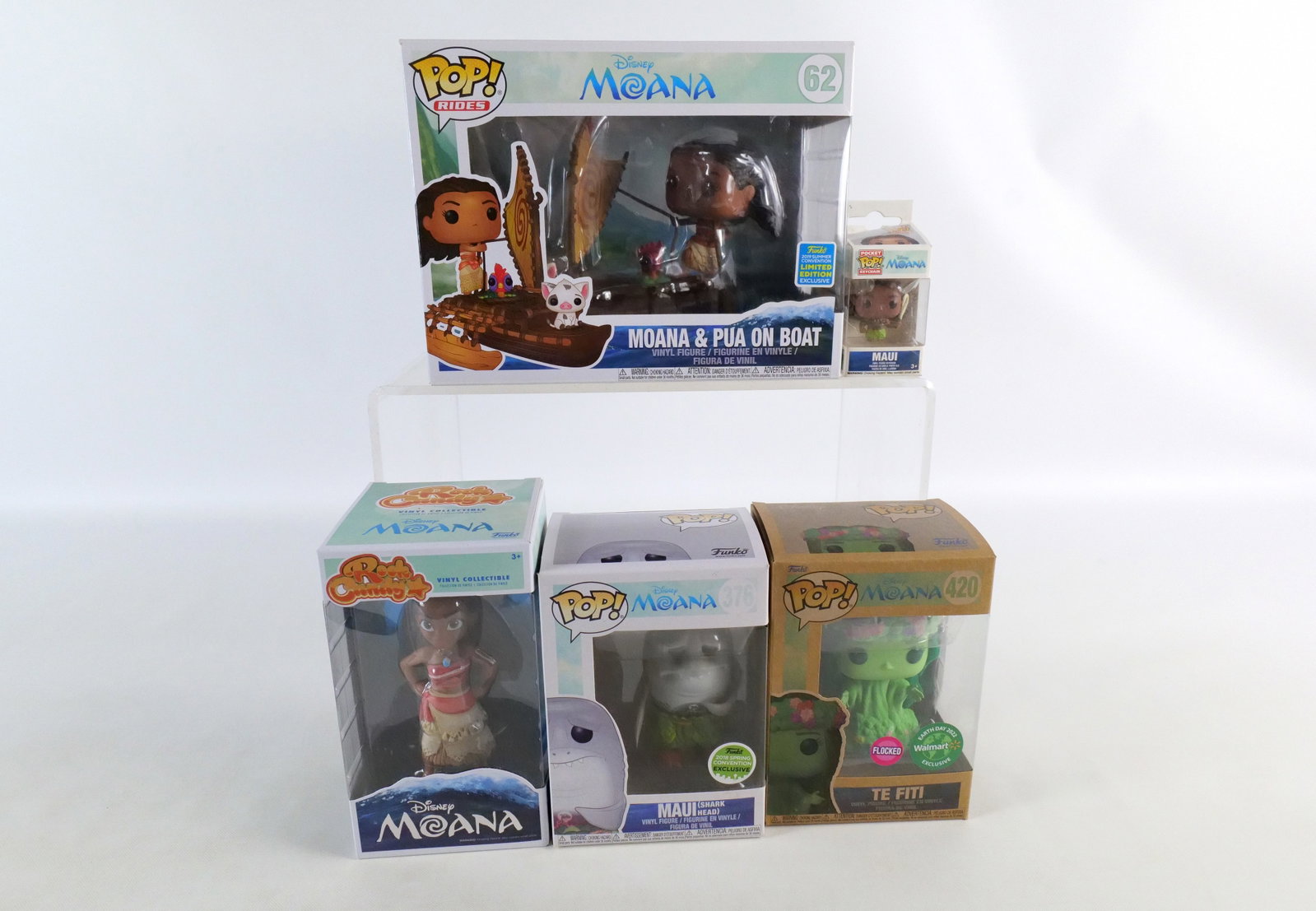 Lot of Funko Disney Moana Collectibles: Lot of Funko Disney Moana Collectibles. Including Pops: Moana & Pua on Boat #62 Summer Convention Exclusive, Maui (Shark Head) #376 Spring Convention Exclusive, and Te Fiti #420 Flocked Earth Day Excl