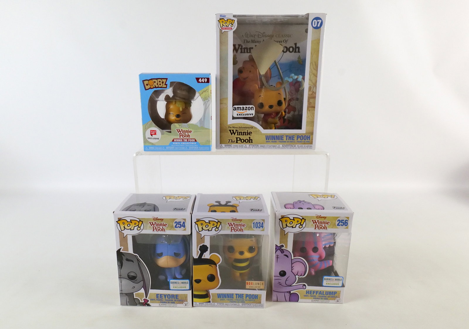 Lot of 5 Funko Disney Winnie the Pooh Collectibles: Lot of 5 Funko Disney Winnie the Pooh Collectibles. Including VHS Covers: Winnie the Pooh #07 Amazon Exclusive, Pops: Eeyore #254 Barnes & Noble Exclusive, Heffalump #256 Barnes & Noble Exclusive, and