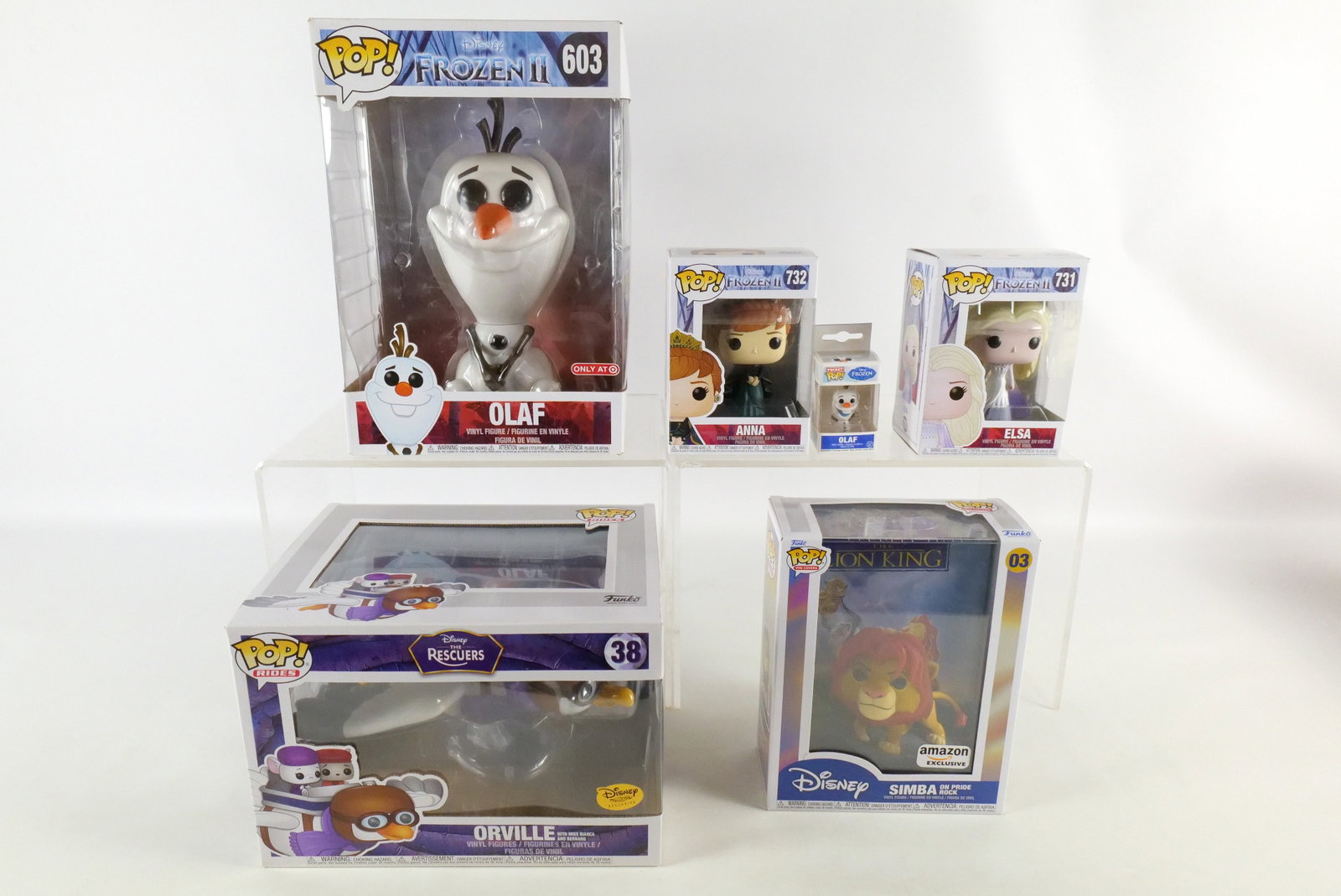 Lot of Funko Disney Pops: Lot of Funko Disney Pops. Including VHS Covers: The Lion King - Simba on Pride Rock #03, The Rescuers: Orville #37 Disney Treasures Exclusive, Disney Frozen II: Olaf #603, Elsa #731, Anna #732, and Di
