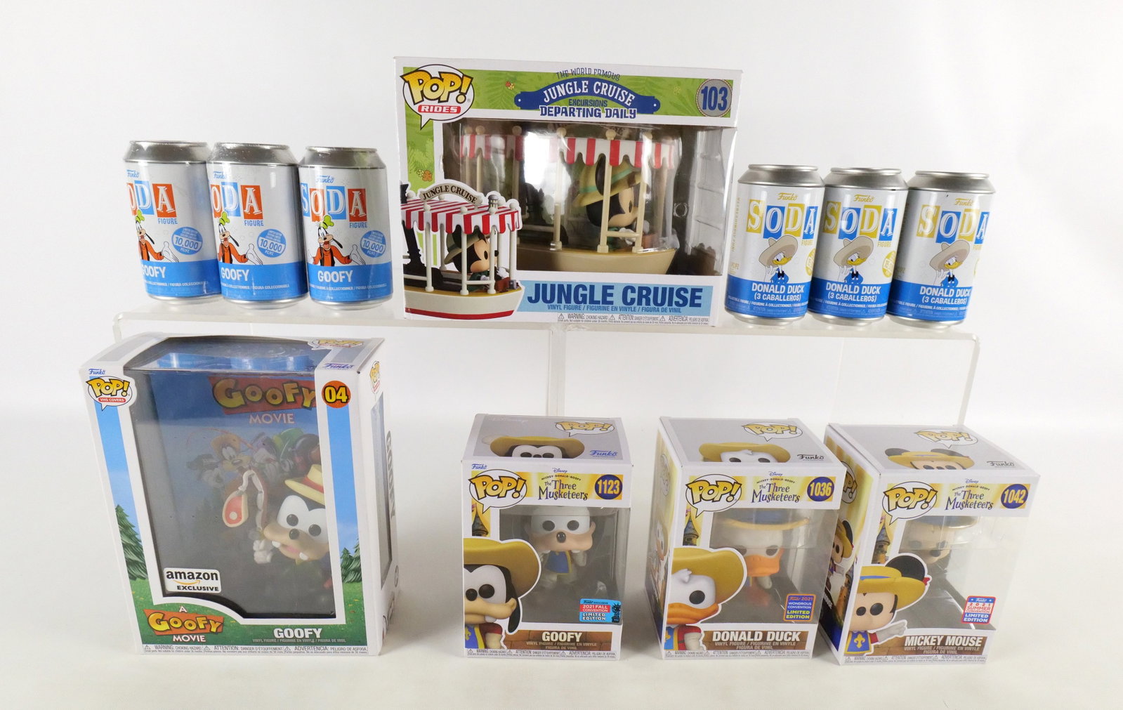 Lot of Funko Disney Collectibles: Lot of Funko Disney Collectibles. Including Pops: The Three Musketeers: Goofy #1123 Fall Convention Exclusive, Donald Duck #1036 Wonderous Convention Exclusive, and Mickey Mouse #1042 Summer Conventio
