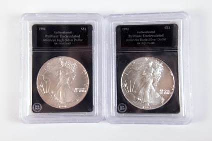 2 Silver Eagle $1
