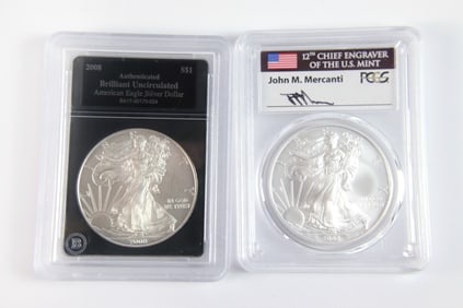 2 Silver Eagle $1