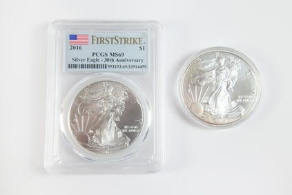 2 Silver Eagle $1