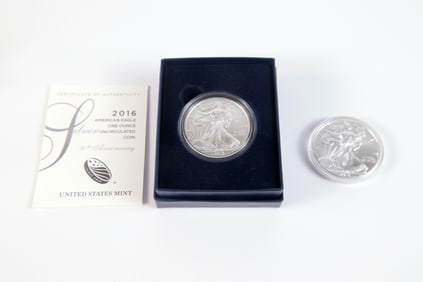 2 Silver Eagle $1