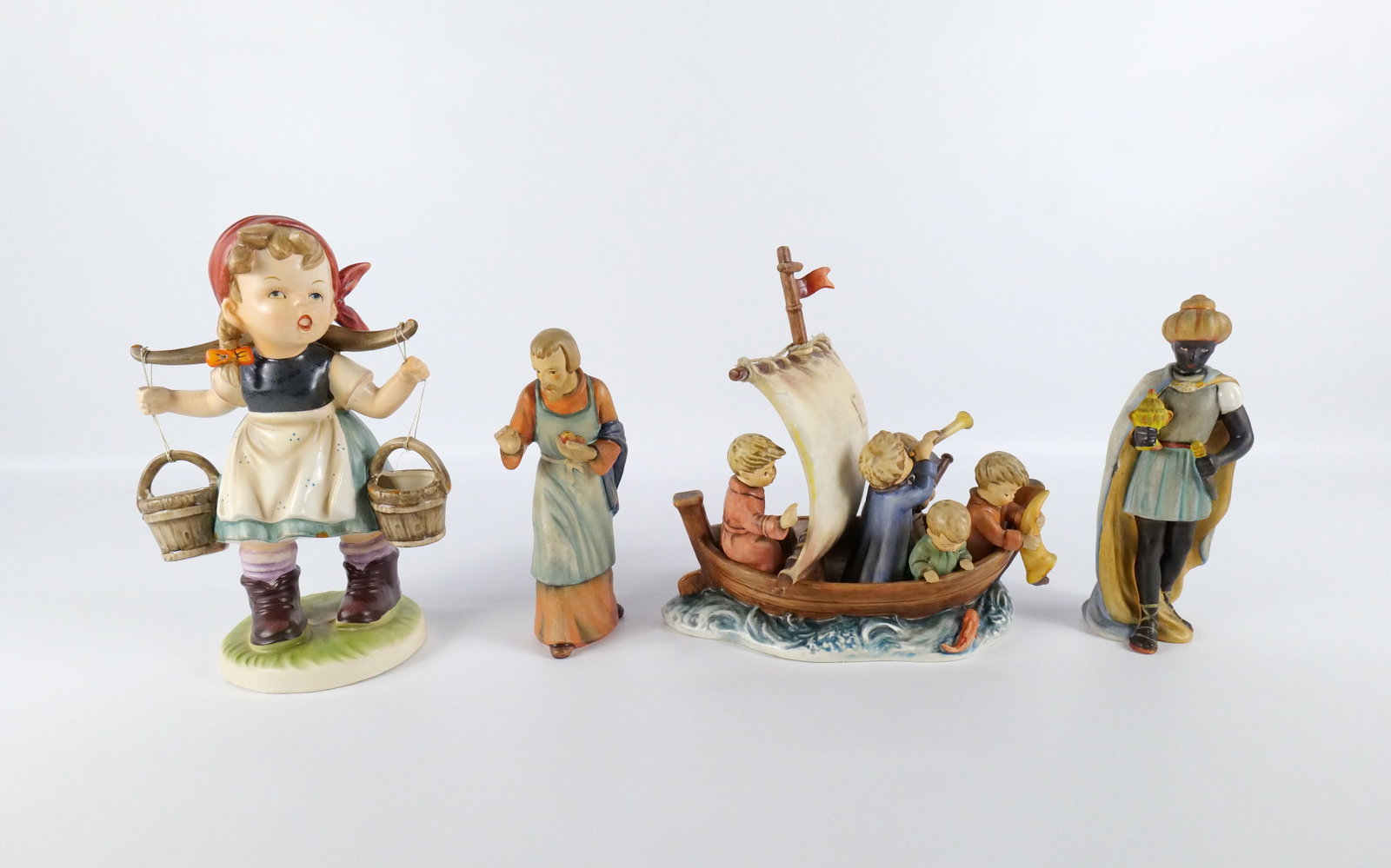 Lot of Hummel and Hummel Style Figurines: Lot of Hummel and Hummel Style Figurines. Including Hummel Goebel Moorish King - Chip on robe, Hummel Goebel Joseph - Good Condition, Hummel Land in Sight - Broken Flag and Boy on Back has been reglue