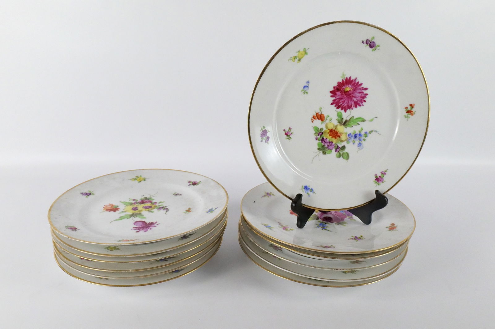 Set of 12 Royal Vienna Hand Painted Dinner Plates: Set of 12 Royal Vienna Hand Painted Dinner Plates. Circa 1910-1920. All in good condition with some loss to the gold trim. Measures 9.5" diameter. All invoices must be paid within 24 hours of the sale