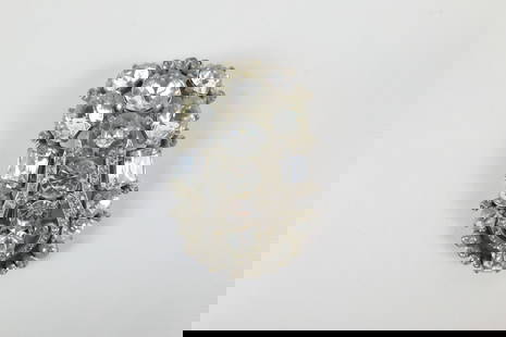 Large Vintage Eisenburg Original Fur Pin: Large Vintage Eisenburg Original Fur Pin. The lot includes a large vintage 2.79'' x 1.95'' silver tone fur clip by Eisenburg Originals set with faceted glass gems in various shapes and sizes with a la