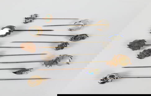 Group of 10 Antique Stick Pins: Group of 10 Antique Stick Pins. The lot includes a mix of 10 late 19th century and early 20th century stick pins in a variety of styles such as art nouveau and art deco. They range in size from 4'' to