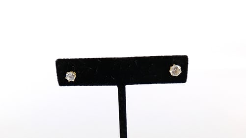 A Pair of Single Diamond Stud Earrings