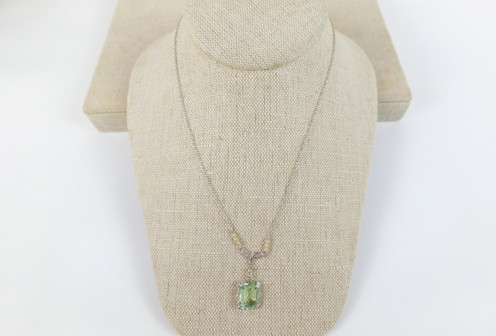 10K Gold Art Deco Necklace: 10K Gold Art Deco Necklace. The lot includes a vintage art deco 16'' long , 10K white gold early deco necklace consisting of a fine round link chain with a 1.16'' long attached pendant set with a mint