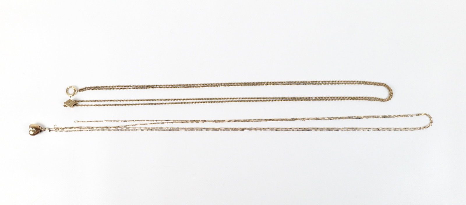 Pair of 19th Century Gold Filled Slide Chains: Pair of 19th Century Gold Filled Slide Chains. The lot includes a pair of 19th century gold filled slide chains. Featuring a 46'' long rope slide chain with .42'' x .29'' kite shaped slide set with a 