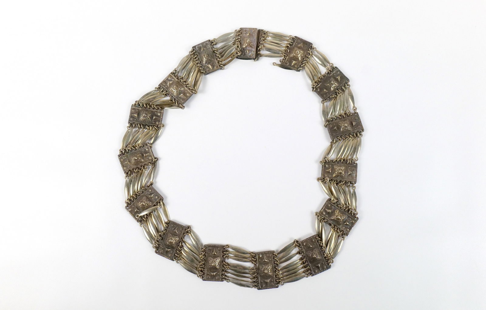 Vintage Mexican Sterling Belt : Vintage Mexican Sterling Belt. The lot includes a 28'' long by 1.20'' wide Mexican made sterling belt consisting of rectangular solid sterling panels joined by stacked 1'' elongated oval links and a h