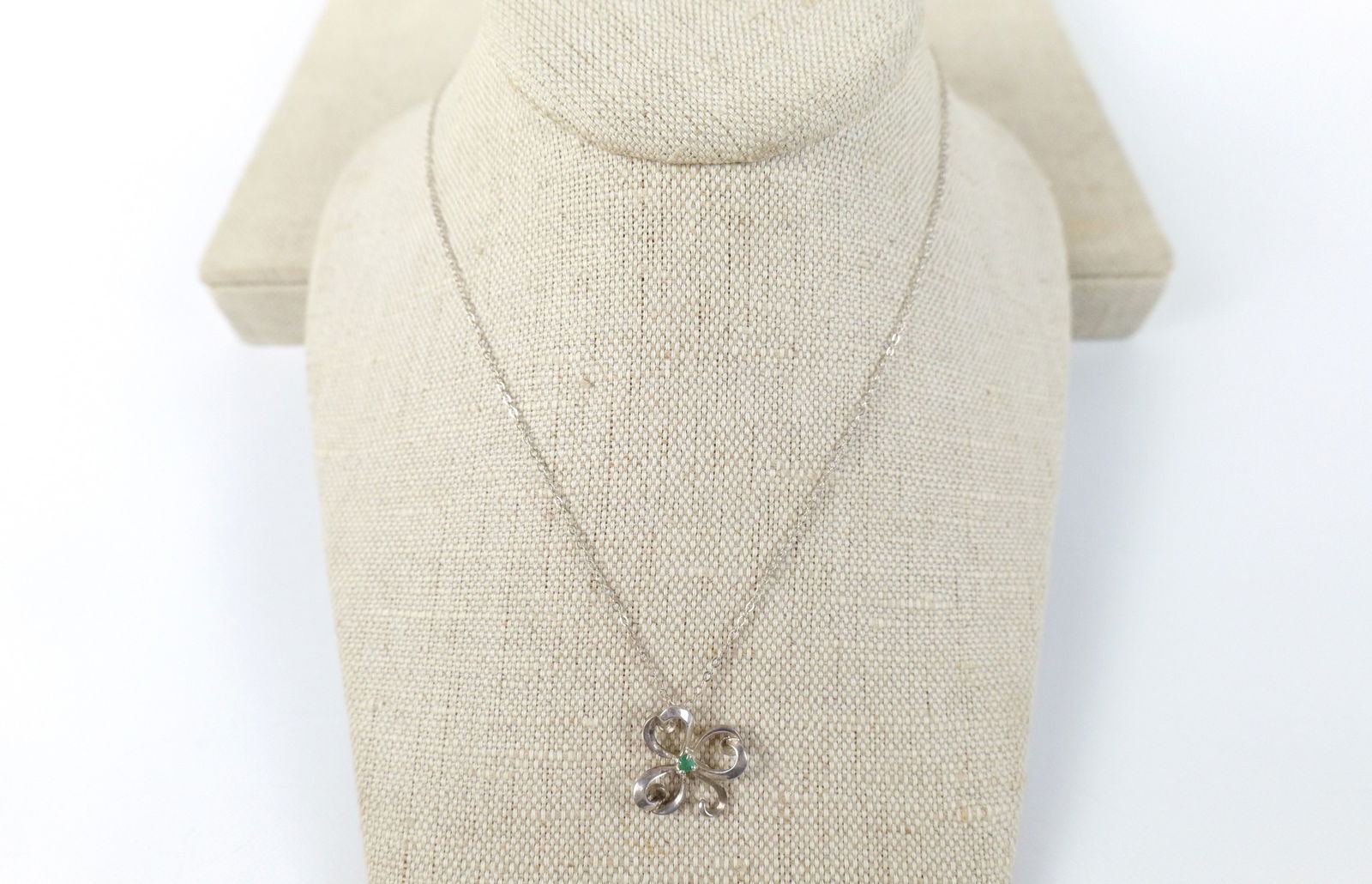 Vintage Sterling Shamrock Necklace : Vintage Sterling Shamrock Necklace. The lot includes a 16'' long fine sterling chain with a spring ring closure and a .74'' x .75'' vintage c1981 shamrock outline pendant with a 2mm round emerald at i