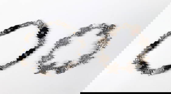 Pair of Vintage Sterling Bracelets: Pair of Vintage Sterling Bracelets. The lot includes a pair of vintage sterling bracelets. Featuring a 6'' long sterling childrens bracelet consisting of alternating anthropomorphic rat links with a s