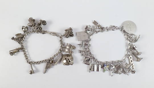Pair of Vintage Sterling Charm Bracelets: Pair of Vintage Sterling Charm Bracelets. The lot includes a pair of vintage 1960s sterling charm bracelets. Featuring a 7.5'' long bar and ring link sterling bracelet with a spring ring clasp and 20