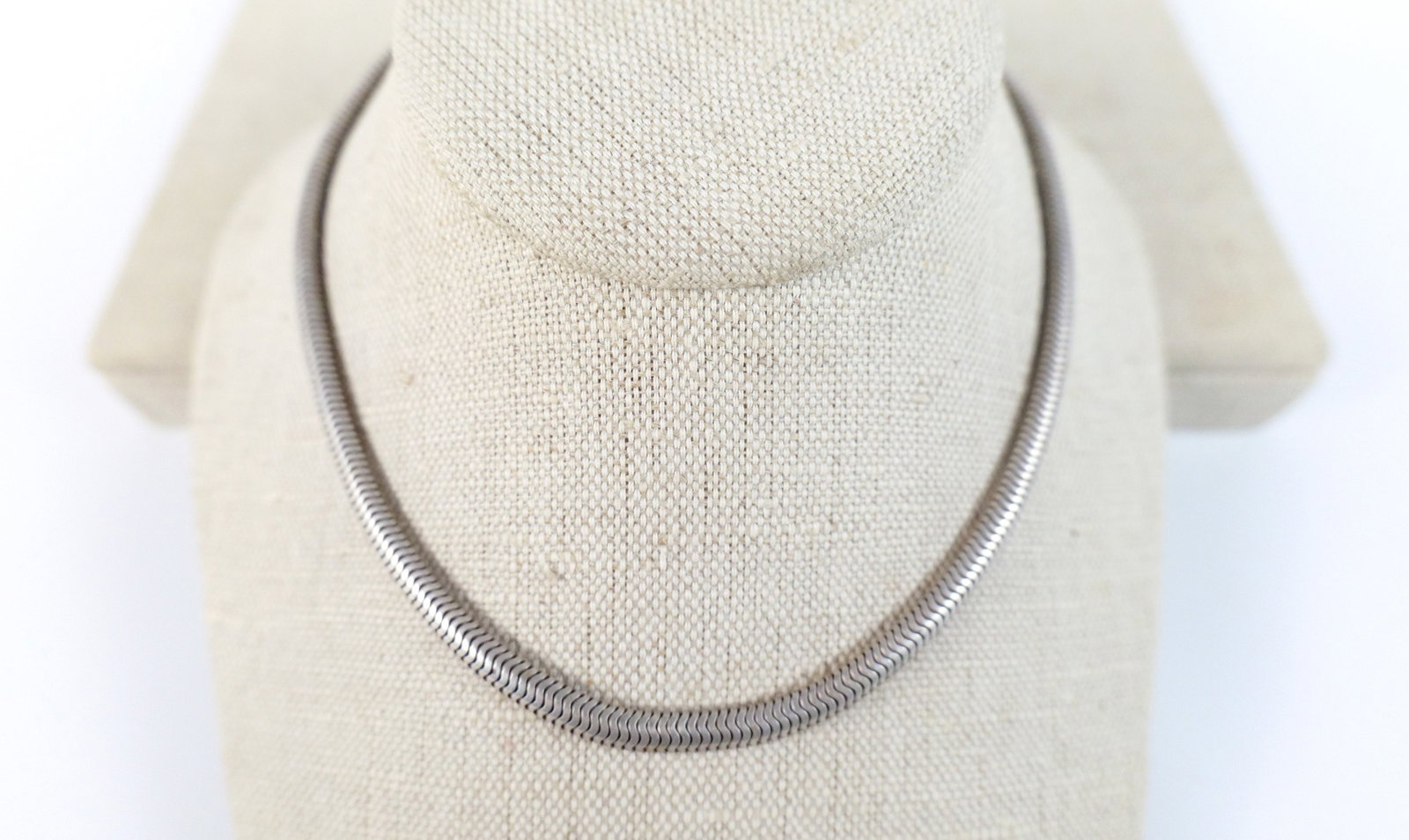 Sterling Fluid Chain Necklace: Sterling Fluid Chain Necklace. The lot included a 14'' long sterling fluid chain necklace with a nearly 1/4'' width and a spring ring closure. Marked 925 and weighs 30.3 grams. Used. All invoices must