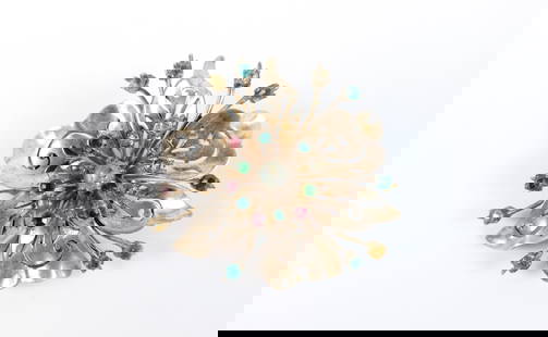 1940s Sterling Coro Craft Flower Brooch: 1940s Sterling Coro Craft Flower Brooch. The lot includes a vintage 1940s 2.33'' x 2.18'' sterling flower brooch by Coro Craft lily brooch with multicolored rhinestone accents, petals with pierced scr