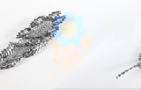Vintage 1940s Sterling Flower Brooch by Reja: Vintage 1940s Sterling Flower Brooch by Reja. The lot includes a vintage 1940s 2.68'' x 1.78'' gold vermeil sterling flower brooch by Reja featuring round light blue glass gems and white rhinestone