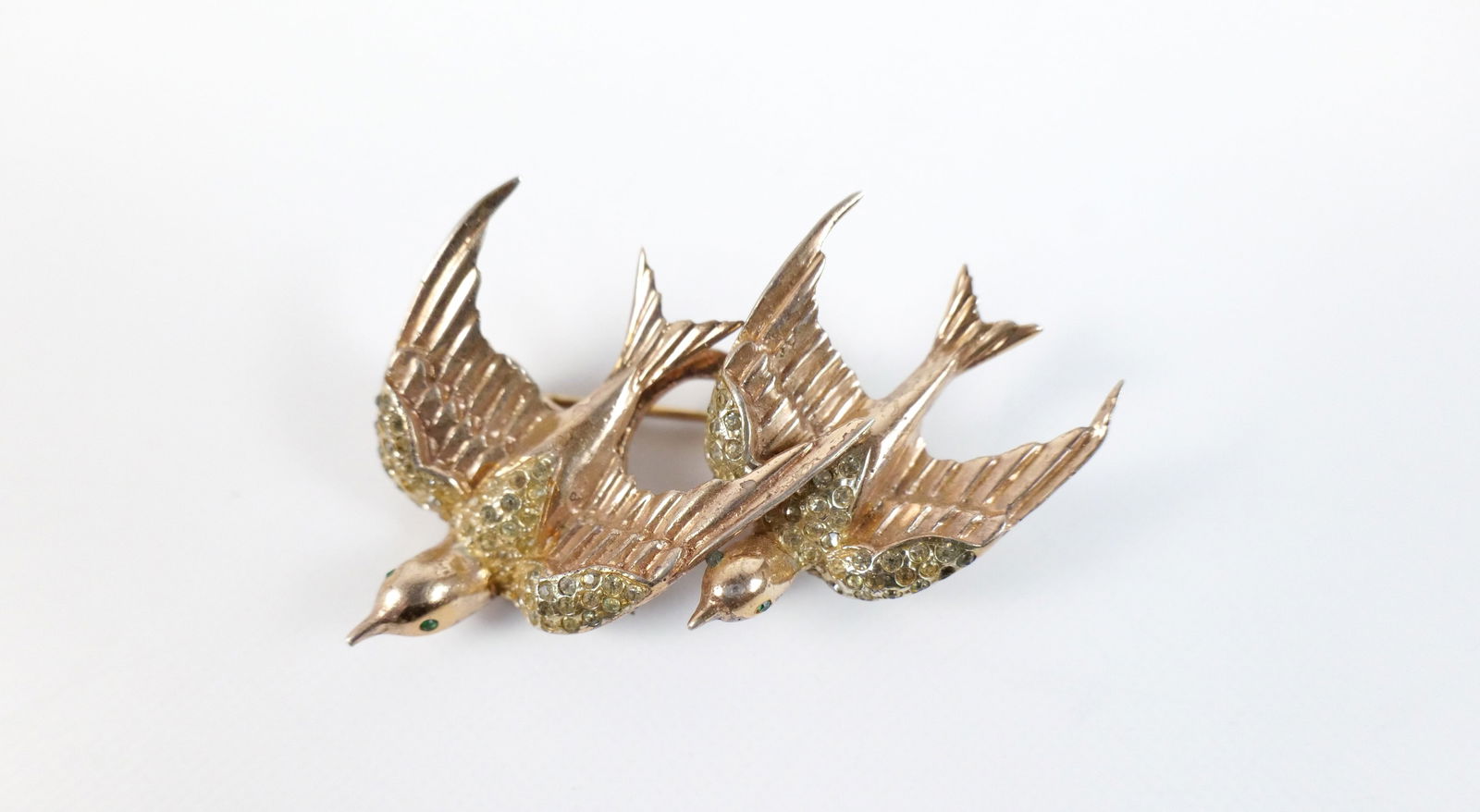 Vintage 1940s Sterling Duette Brooch by Coro: Vintage 1940s Sterling Duette Brooch by Coro. The lot includes a vintage 1940s 2.11'' x 1.34'' gold vermeil sterling duette brooch by Coro Craft comprised of two sparrow fur clips with rhinestone acce