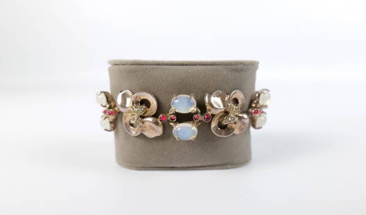 Vintage 1940s Sterling "Moonstone" Bracelet: Vintage 1940s Sterling "Moonstone" Bracelet. The lot includes a vintage 1940s 7.5'' long gold vermeil sterling bracelet in the style of Trifari set with oval glass "moonstone" cabochons and red and wh