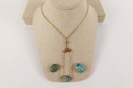 Vintage Egyptian Revival Necklace and More: Vintage Egyptian Revival Necklace and More. The lot includes a vintage 1930s Egyptian revival necklace and more. Featuring a 16'' long necklace comprised of oval gold tone link chain, 3 1/4'' chain lo