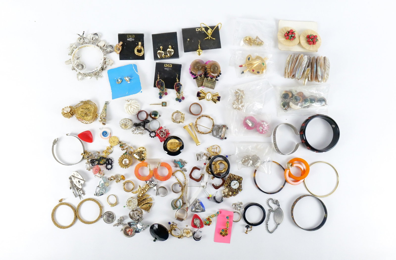 Large Group of Vintage Costume Jewelry: Large Group of Vintage Costume Jewelry. The lot includes a mix of vintage costume jewelry from the 1950s to the 1990s. Featuring 35 pairs of vintage clip-on and post back earrings in a variety of styl