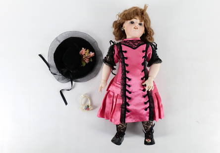Antique Porcelain Doll: Antique Porcelain Doll. Composition Body. Some crazing throughout. Some molding present on her face. Unmarked. Measures 20" long x 8" wide. All invoices must be paid within 24 hours of the sale. We of