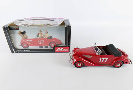 Schuco BMW 327 Cabrio Sport Tin Litho Key Wind Car: Schuco BMW 327 Cabrio Sport Tin Litho Key Wind Car. Some minor paint scuffing on the dashboard. Comes in original box with key and paperwork. Box has significant wear. All invoices must be paid within
