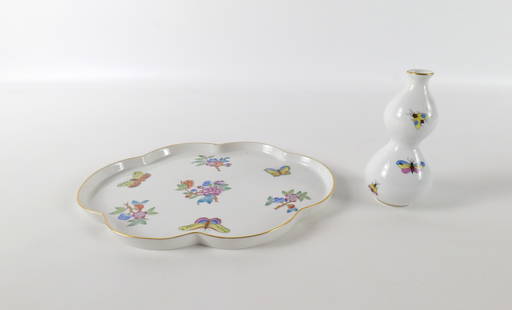 Lot of 2 Pieces of Herend Porcelain: Lot of 2 Pieces of Herend Porcelain. Including Queen Victoria Dresser Tray and Rothchild Bud Vase. Largest measures 5" tall. All invoices must be paid within 24 hours of the sale. We offer multiple sh