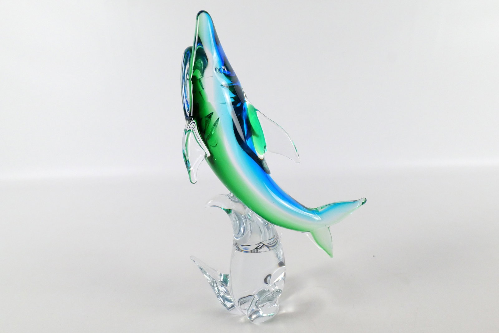 Murano Art Glass Jumping Shark Figurine: Murano Art Glass Jumping Shark Figurine. Has Sticker Rubelli V.A. Murano. Measures 13.5" tall x 6.5" wide. All invoices must be paid within 24 hours of the sale. We offer multiple shipping options ple