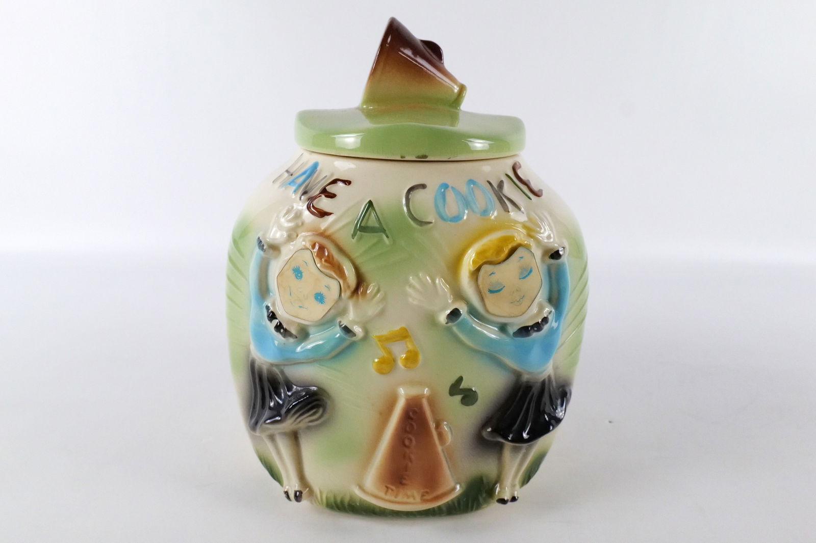 Vintage Cheerleader Flasher Corner Cookie Jar: Vintage American Bisque Cheerleader Flasher Corner Cookie Jar. Overall good condition with some crazing. Measures 11" tall x 9" wide. All invoices must be paid within 24 hours of the sale. We offer mu