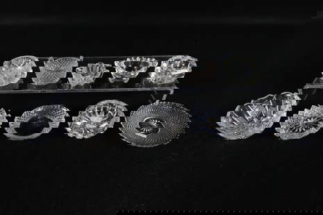 Lot of 7 Antique Cut and Pressed Glass Table Salt Cellars: Lot of 7 Antique Cut and Pressed Glass Table Salt Cellars. 3 come with Underplates/Butter Pats. One plate has a small chip. Tallest measures 1.5". All invoices must be paid within 24 hours of the