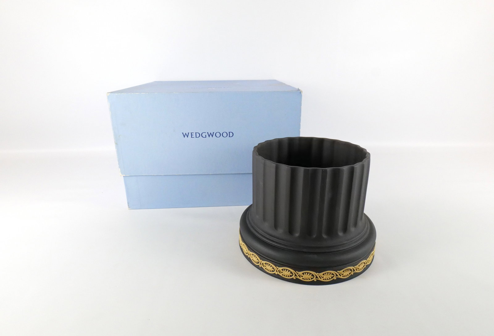Wedgwood Library Collection Jasperware Column Planter: Wedgwood Library Collection Jasperware Column Planter. In Black and Cane Yellow. Comes with Original Box. Can be used for potted plants or as a pedestal. Measures 6.5" tall x 9" wide. All invoices mus