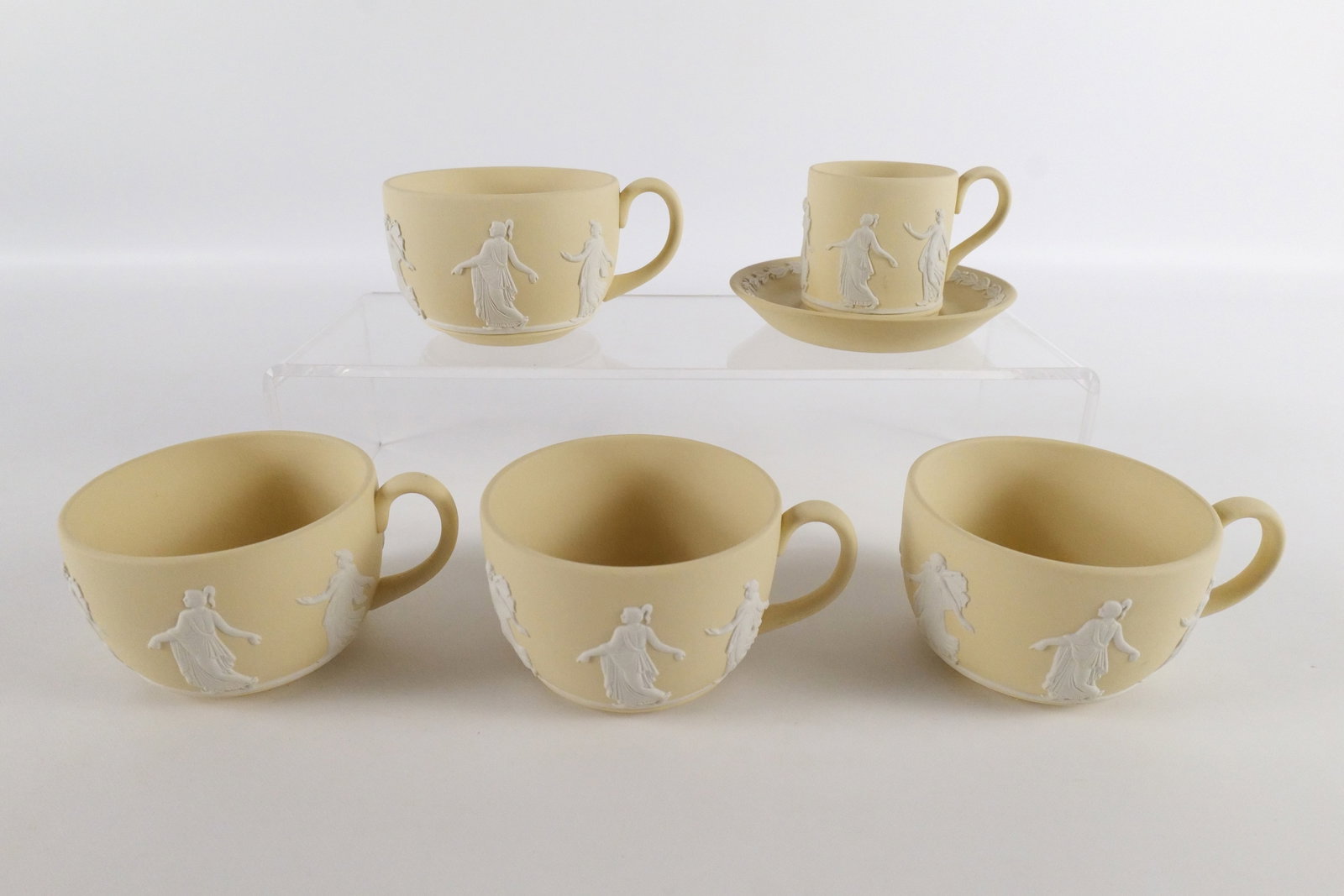 Lot of 6 Wedgwood Primrose Yellow Jasperware Dancing Hours Pieces: Lot of 6 Wedgwood Primrose Yellow Jasperware Dancing Hours Pieces. Including Demitasse Cup and Saucer measuring 2.75" tall and (4) Tea Cups. All come with original boxes. All invoices must be paid wit