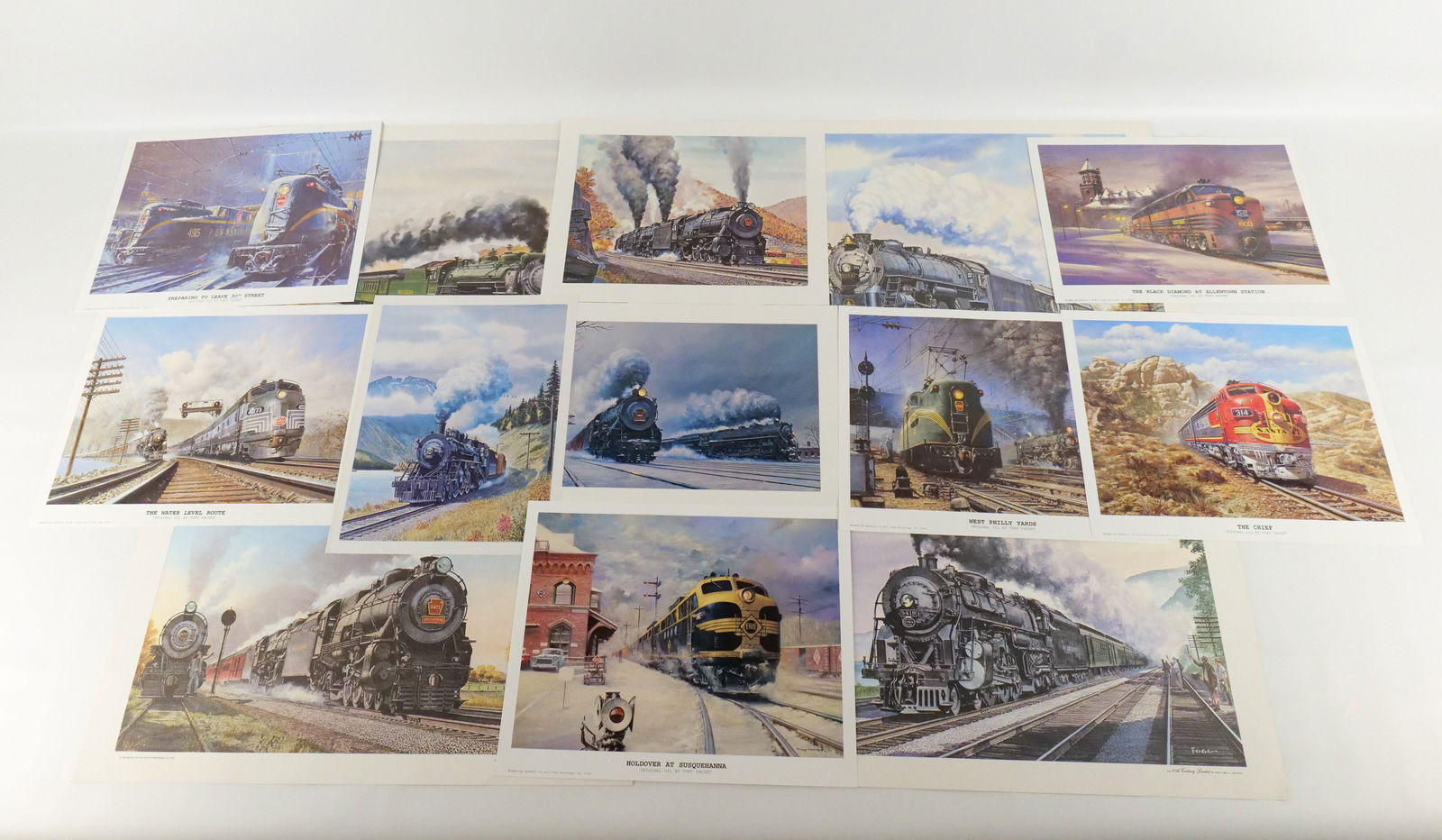 Lot of Mixed Unframed Train Lithographs and Prints: Lot of Mixed Unframed Train Lithographs and Prints by Howard Fogg and Tony Fachet. Including Tony Fachet: "Holdover at Susquehanna", "Preparing to Leave 30th Street", "The Black Diamond at Allentown S