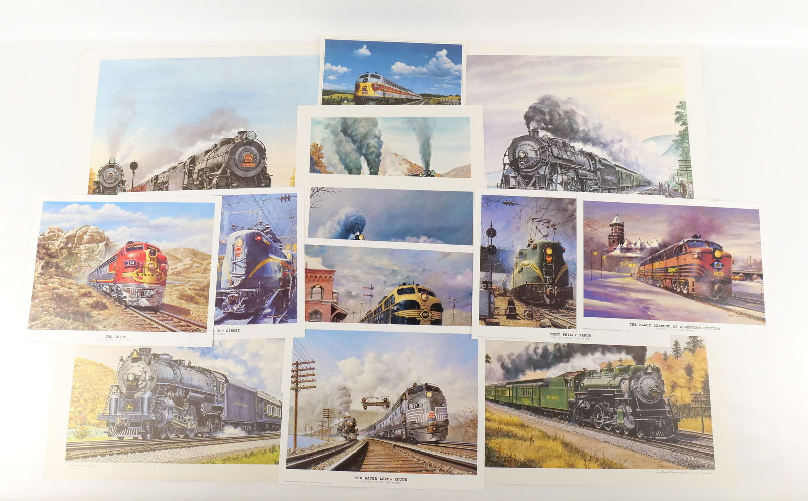 Lot of Mixed Unframed Train Lithographs and Prints: Lot of Mixed Unframed Train Lithographs and Prints by Howard Fogg and Tony Fachet. Including Tony Fachet: "Holdover at Susquehanna", "Preparing to Leave 30th Street", "The Black Diamond at Allentown S