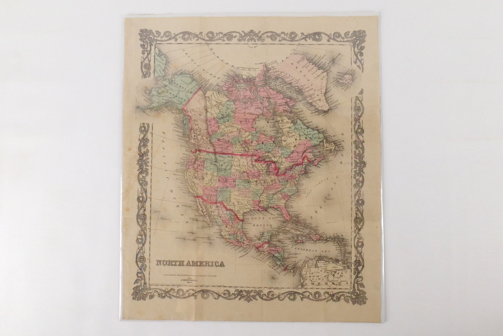Hand Colored Map of North America: Hand Colored Map of North America by J.H. Colton & Co. NY for J. Disturnell - 1864. Some discoloration and possible water damage to the left side center. Measures 17" tall x 14.25" wide. All invoices 