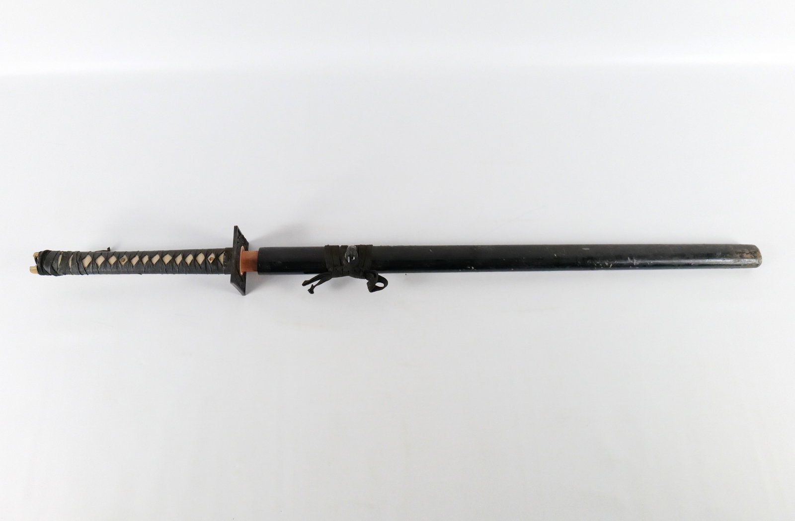 Vintage Japanese Katana Sword: Vintage Japanese Katana Sword. Some scuffing and nicks to the sheath. Measures 43" long. All invoices must be paid within 24 hours of the sale. We offer multiple shipping options, please read the ship